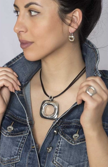 Woman wearing short double-wrap leather necklace with silver-plated metal pieces and silver-plated metal plate