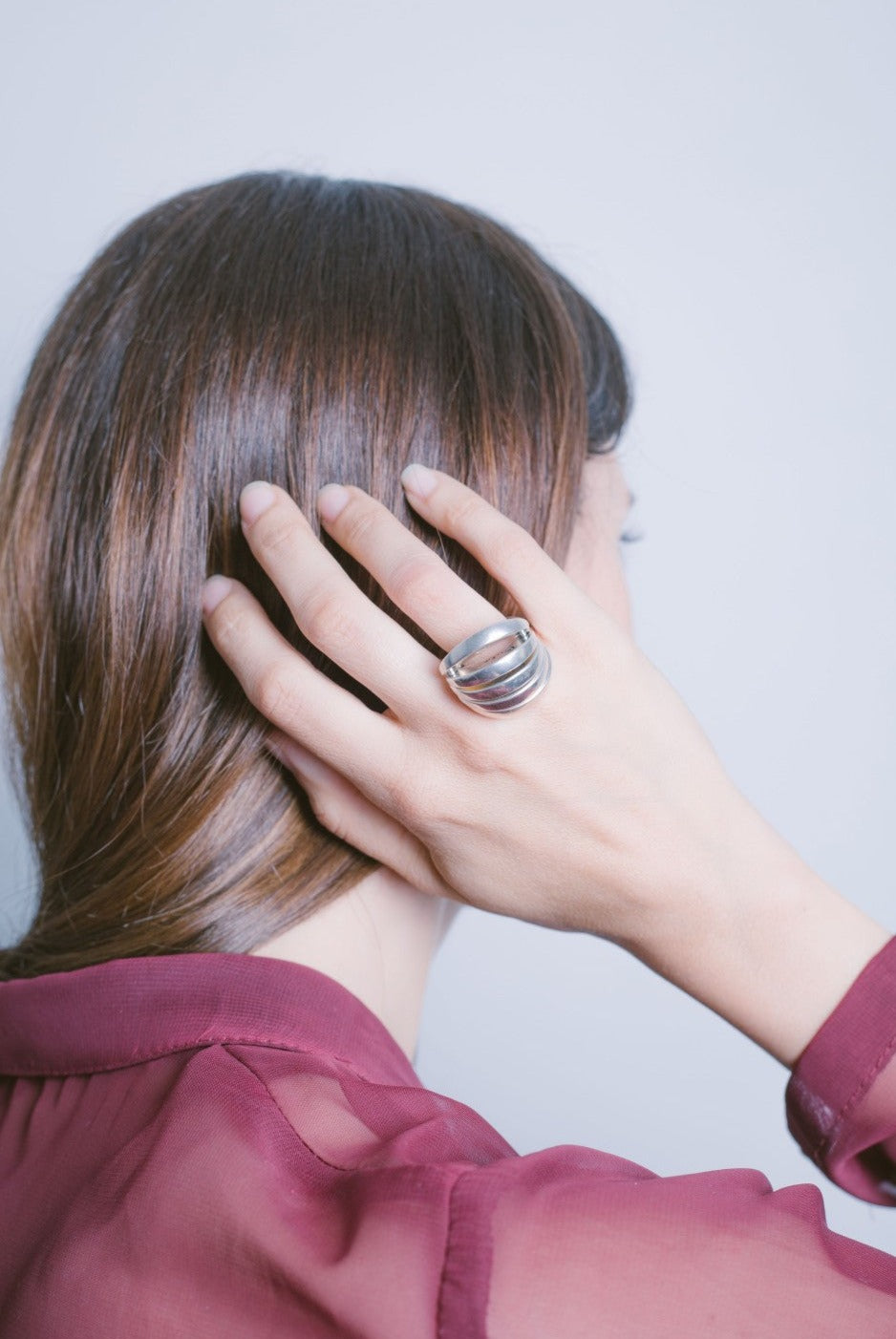 woman wearing articulated armadillo women’s silver ring