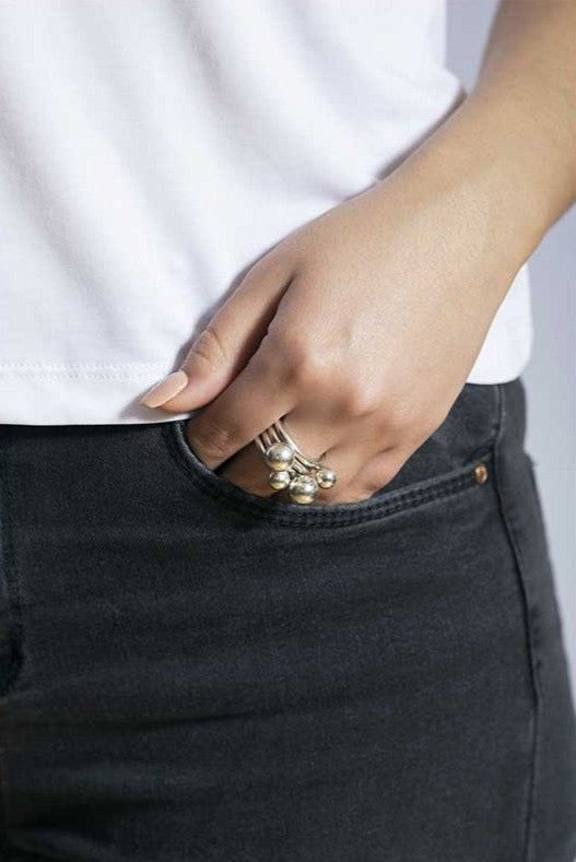 woman wearing silver ring with stackable design 