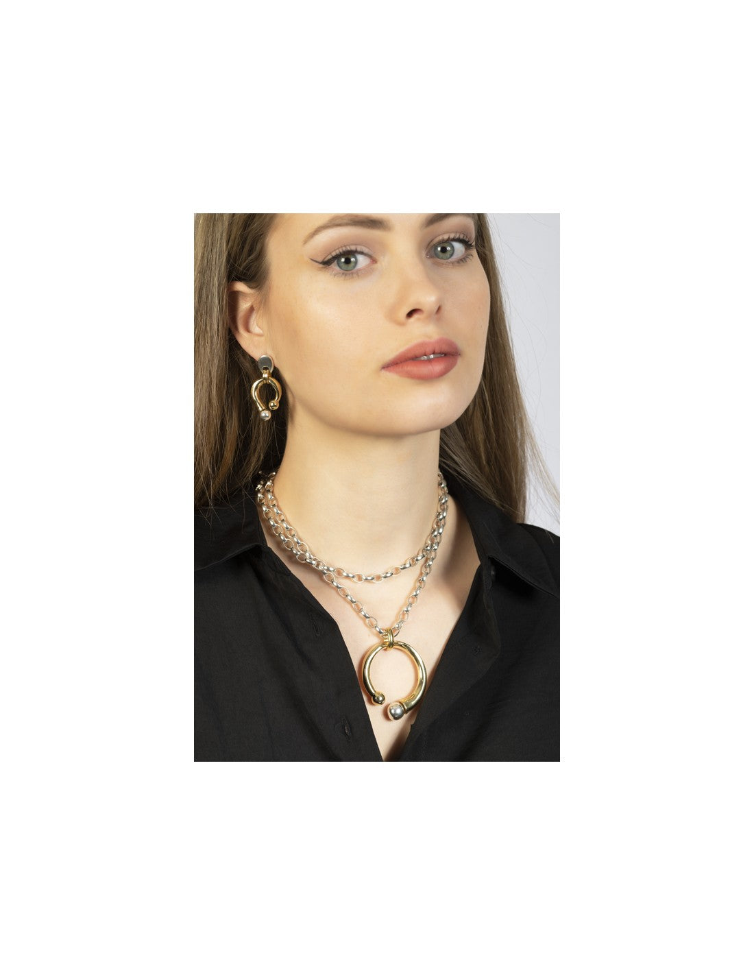 woman wearing silver necklace and gold pendant with interchangeable murano glass tips 