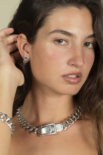 woman wearing silver link necklace with buckle closure