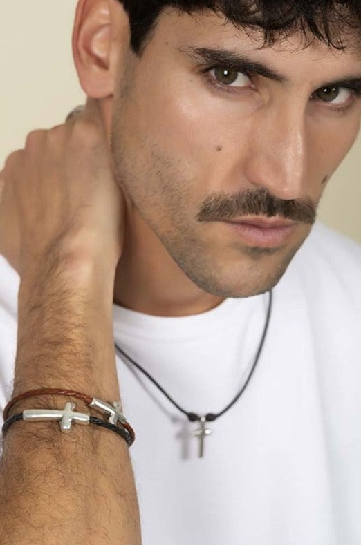 man wearing men's silver-plated bracelet 25mm cross design, mounted on brown braided leather