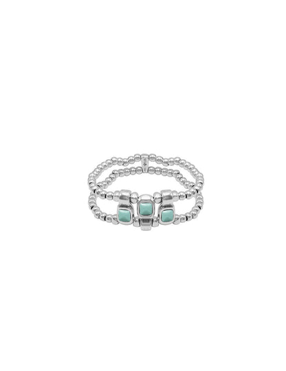 silver bracelet with beaded elastic and intricate turquoise Murano glass details at its center