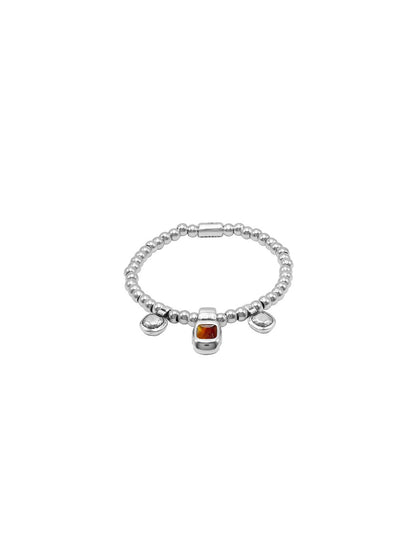 silver bracelet with beaded elastic and intricate brown Murano glass details at its center